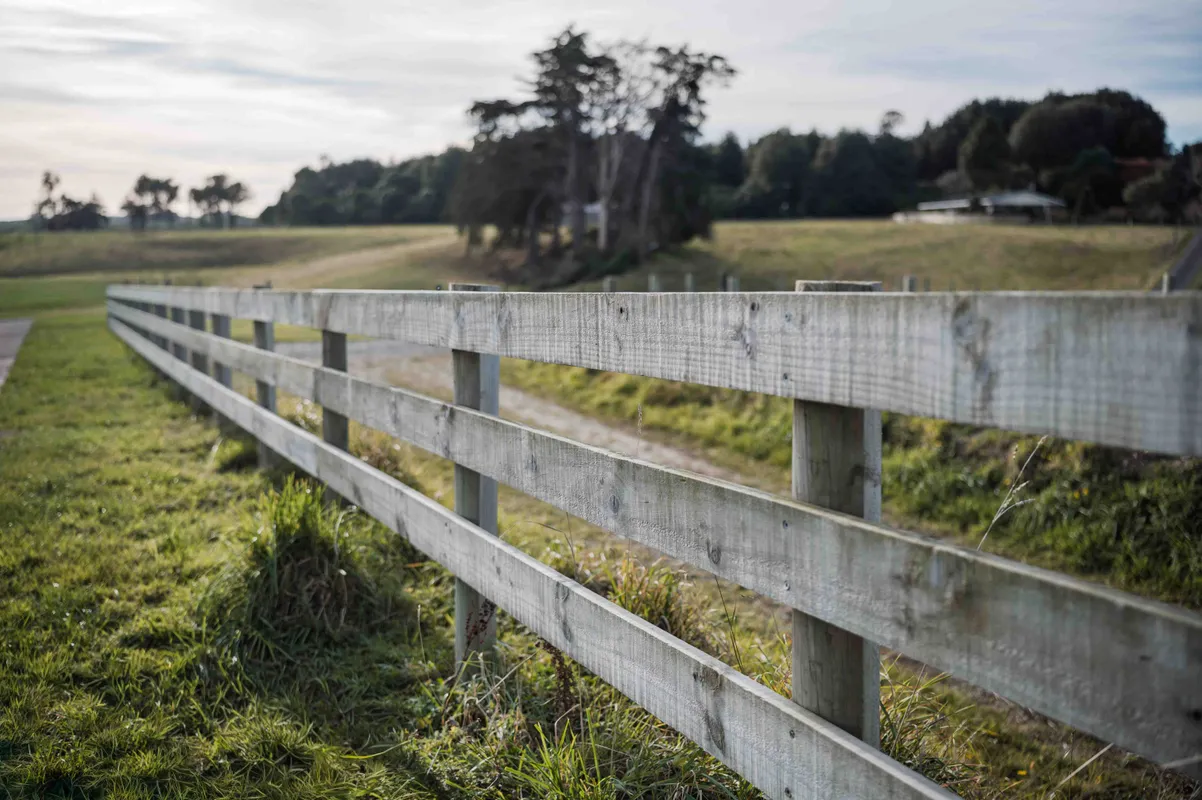 Residential fence wrapping around the property boundary