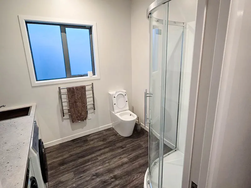 Completed bathroom and laundry renovation, refeshing a space to combine a toilet, shower and washing machine in one room
