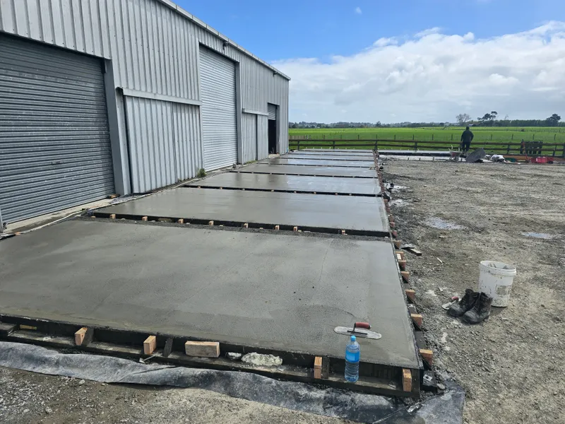 Concrete slabs poured and drying for farm concreting project