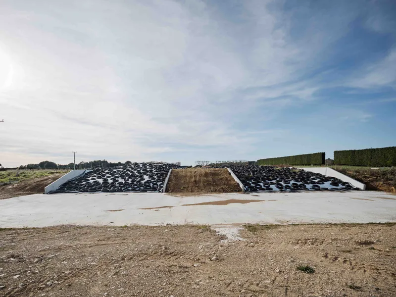 Double concrete bunker silage stacks full of silage ready for efficient feeding out