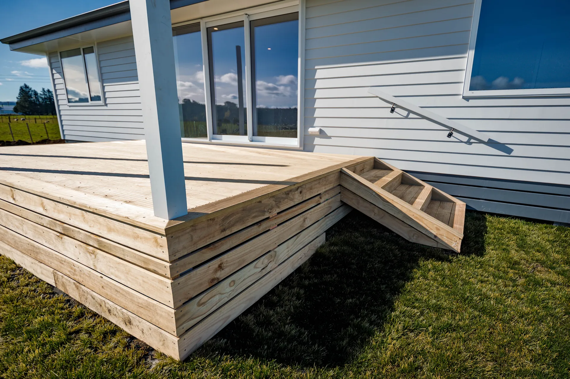 New timber deck built to improve outdoor space on new house with stairs